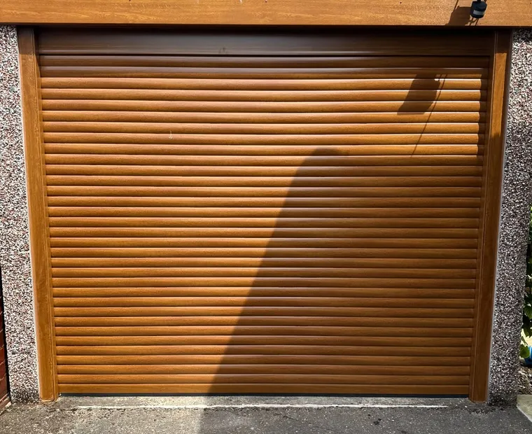 Wood-effect roller garage door installation