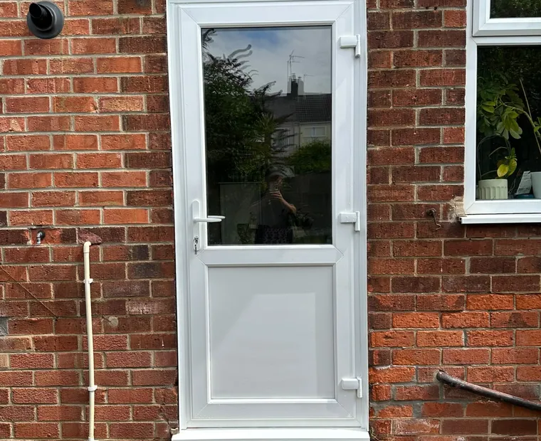 White rear entrance door installation