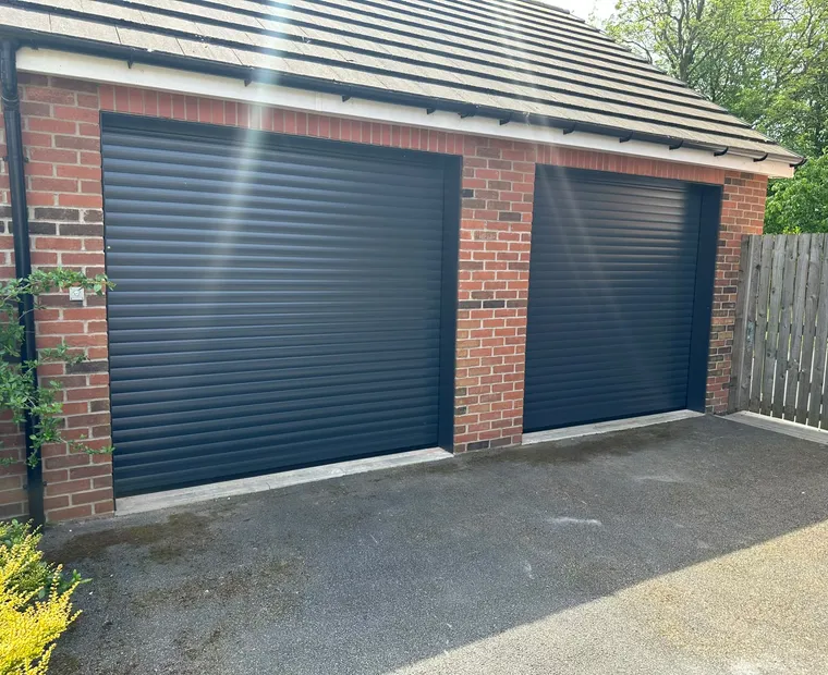 Pair of anthracite roller garage doors