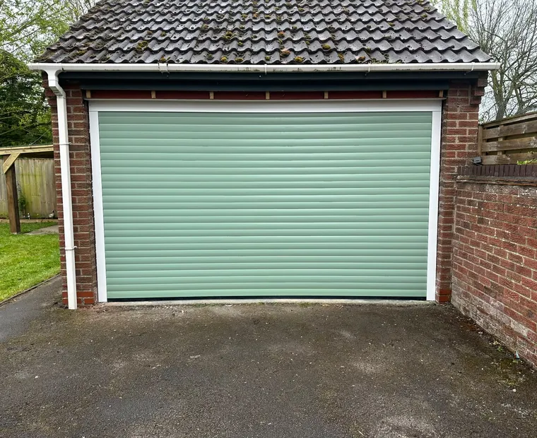 Green detached garage door