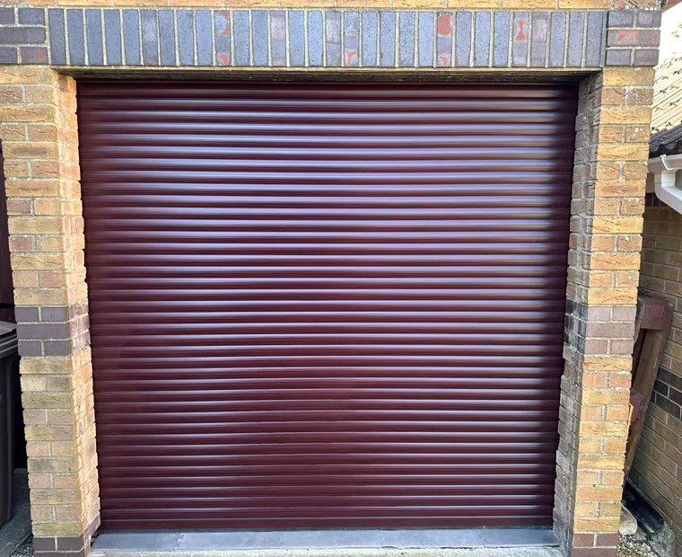 Burgundy roller garage door installation